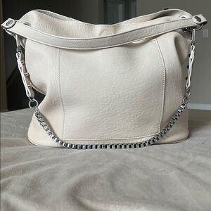 Madison West Purse in a purse
Cream purse w/ silver details.